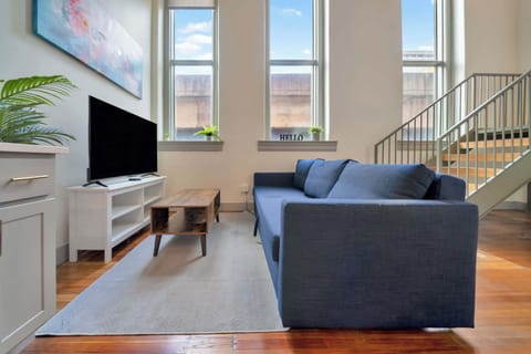 Living Room: Cozy and inviting living room with plenty of natural light—perfect for relaxing after a day of exploring! 🛋☀️