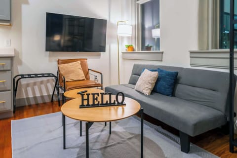 Living Room: Bright and open living area with modern kitchen, perfect for entertaining or relaxing after a long day.