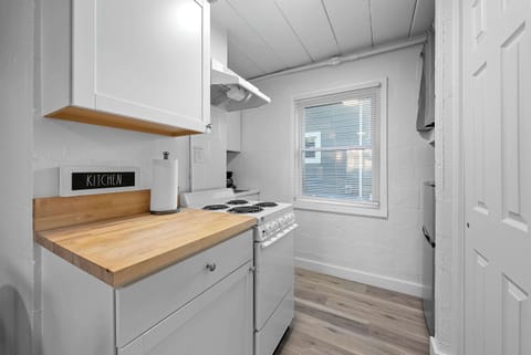 The cozy kitchen offers ample storage space & every home comfort