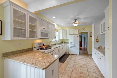 The chic kitchen offers ample space & all the comforts of home