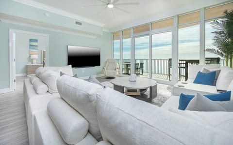 Curl up on the large sectional sofa, stream your favorite shows, then step onto your beachfront balcony
