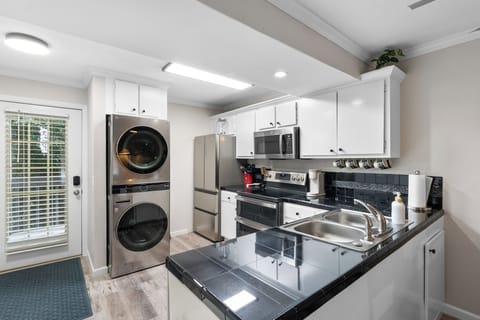 Kitchen with washer and dryer