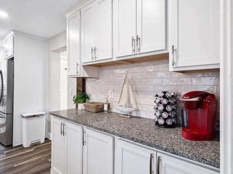  Cozy mornings await! Brew a cup of your favorite coffee in this charming nook designed for ultimate comfort.