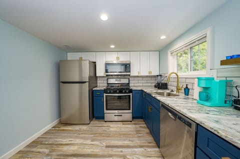 Cook with ease in this spacious, fully equipped kitchen with top-tier appliances.