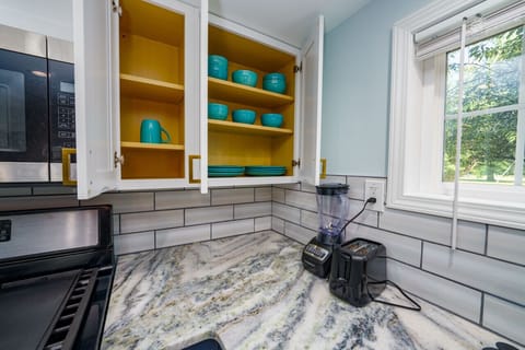 Beautifully appointed kitchen closet – your recipe for a delightful stay.