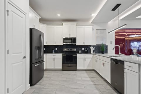 Cook in style in this sleek modern kitchen with quartz counters and stainless steel!