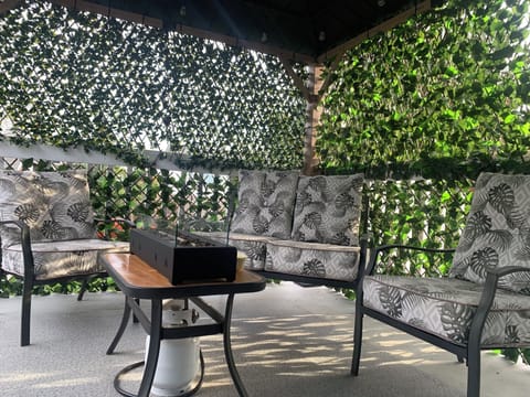 Balcony lounging area with fire pit table - smoking area