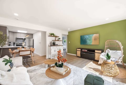 A spacious and airy living room with stylish furniture, perfect for relaxing or entertaining.