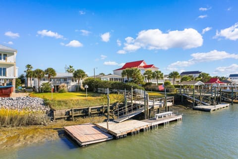 Waterfront property with private dock and boat slip along peaceful waters.