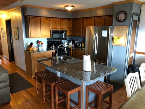 Kitchen with a large refrigerator.