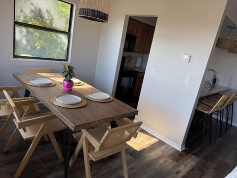 Enjoy meals at the large table and bar seating 