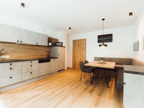 Property, Furniture, Cabinetry, Wood, Lighting, Chair, Interior Design, Countertop, Table, Flooring