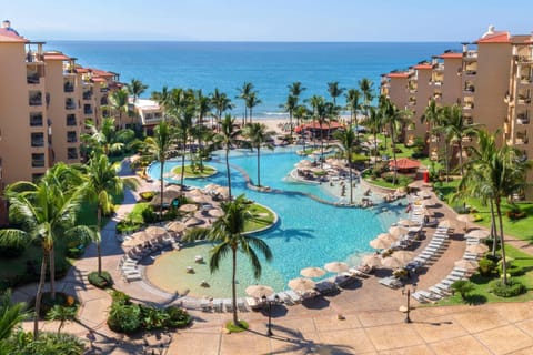 Outdoor pool, pool umbrellas, lounge chairs
