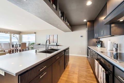 The well-stocked chef's kitchen offers the perfect setting for creating delicious meals and snacks, with ample space for entertaining guests.