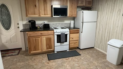 Kitchen showing private entrance door.
