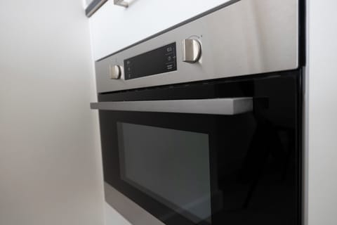 This kitchen features all the essentials, from stainless steel appliances to cookware and utensils, ensuring you have everything you need to cook and enjoy your meals.