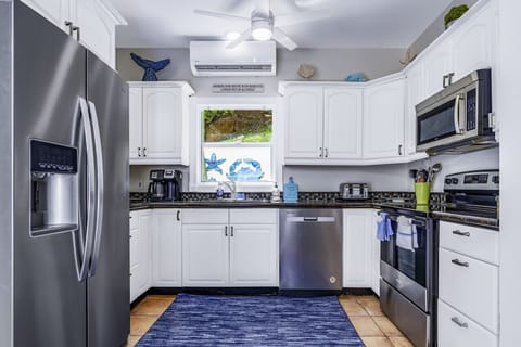 Spacious, well-appointed kitchen with AC.