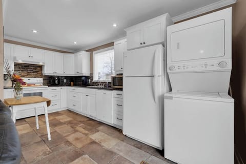 Large kitchen with easily accessible laundry center.