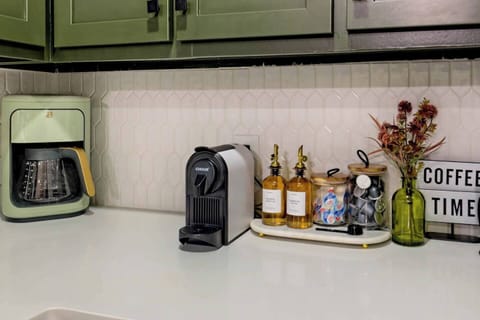 Start your day at the well-stocked coffee station featuring a drip coffee maker, espresso machine, and French press. We provide coffee pods, fresh coffee grounds, and a selection of teas, along with syrups and creamers for each guest's enjoyment.