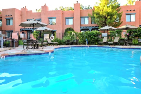 Unwind on shaded loungers with a refreshing swim steps away.