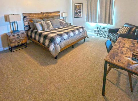 Cozy and comfortable king bed, side chair, and small desk for work. A mini-fridge and microwave with Keurig coffee maker is included.