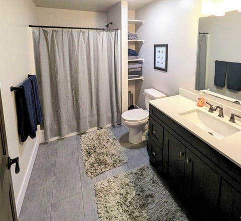 Large stand-up shower in spacious bathroom.