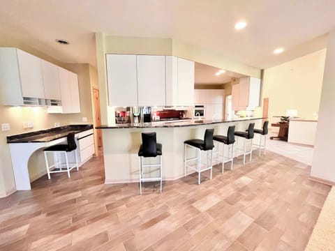 Sip morning coffee or grab a bite at the kitchen counter, with seating for 5