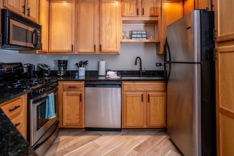 The kitchen offers ample storage space & all the comforts of home