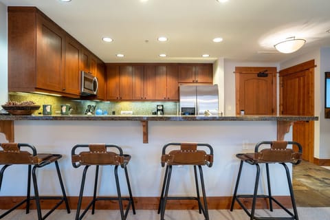 The breakfast bar can seat up to four guests. 