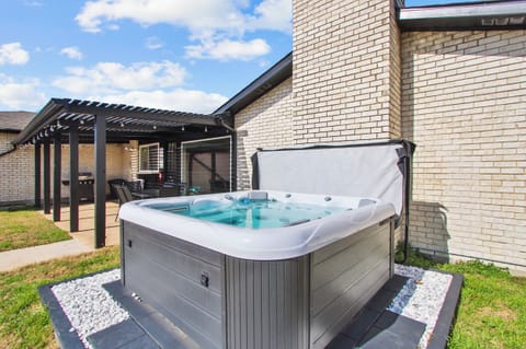 Hot Tub with patio seating and BBQ grill