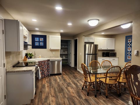 Dining area and kitchen are part of the open great room.