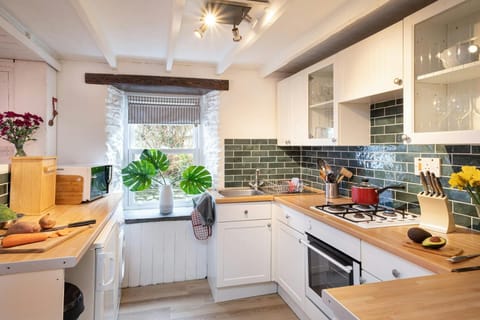 Kitchen, oven with gas hob, microwave, sink, window