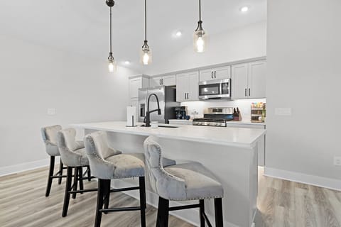 Kitchen Island with four plush bar top seating