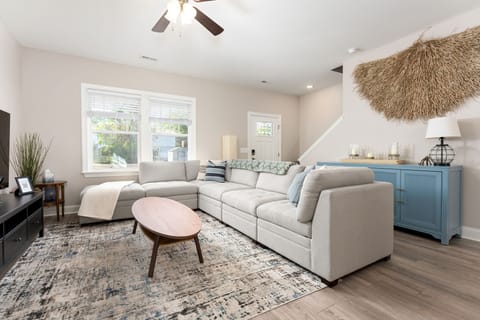Living room with large sectional and smart TV