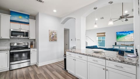 Kitchen overlooks the living area.