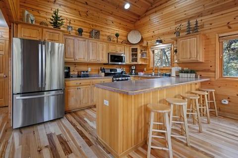 Fully equipped kitchen with ample space for the entire family to gather.