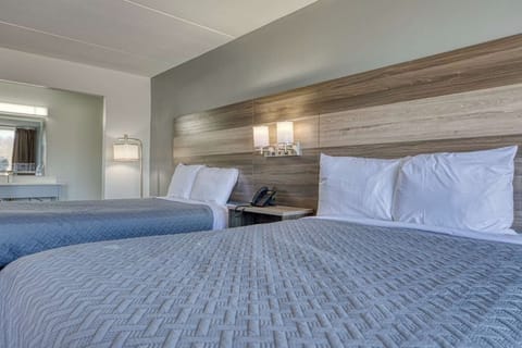 Sink into plush beds and enjoy a calm, modern retreat.