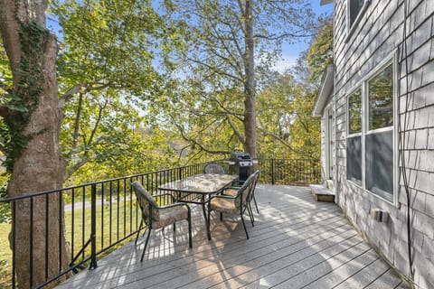 Outdoor deck area with seating and very quiet serene backyard with plenty of privacy