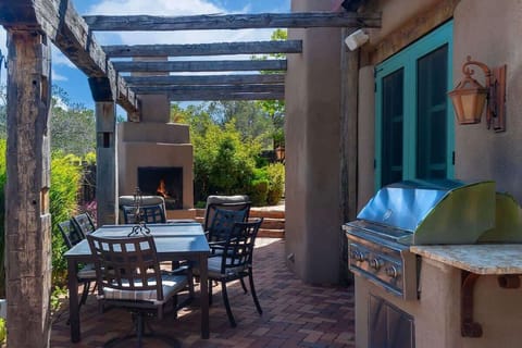 Outdoor Dining Area off Kitchen With BBQ Grill