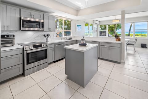 Modern kitchen with stainless steel appliances and a bright, open layout.