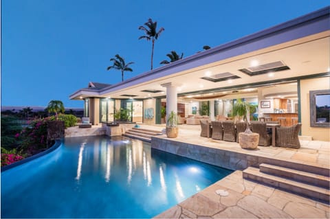 A luxurious infinity‑edge pool set against ocean skyline and palm trees — your private island escape begins here.
