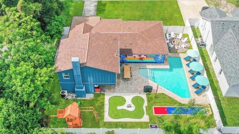 Aerial view of the property showing pool, lawn games & spacious outdoor areas