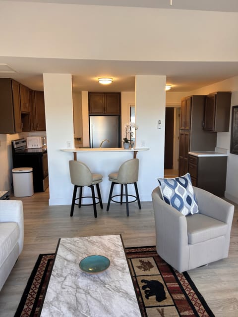 Living room looking towards bar with two
swivel stools and kitchen beyond!