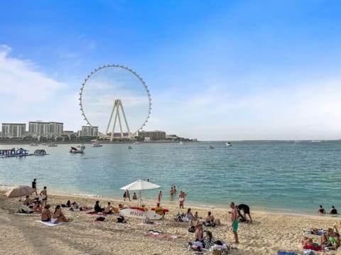 Beachfront Bliss: Enjoy sun-soaked days with stunning views of the iconic Dubai Eye!