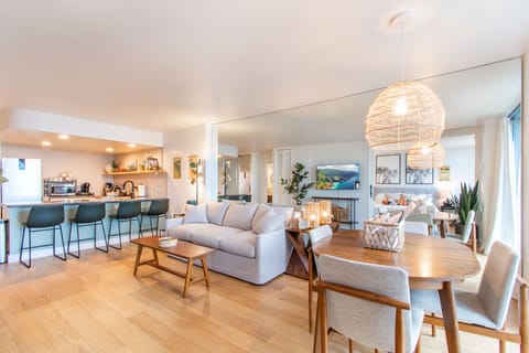 Full kitchen, queen size sofa sleeper and dining table with chairs
