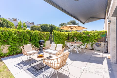 Spacious garden with a patio area.