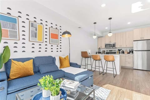 Modern open-concept space with cozy seating, chic kitchen, and stylish details.