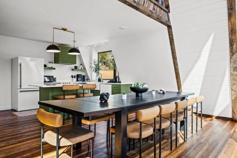 Modern A-frame with designer kitchen & seating for 10—perfect for group meals and cozy nights in.