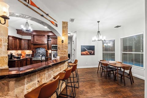 Gather around! Our large kitchen island with high seating is perfect for cooking, chatting, and sipping coffee, with a dining area just steps away for full meals.