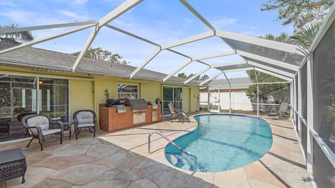 Dive into your exclusive, screened private pool and enjoy the covered patio seating—the ideal spot for sunbathing or an evening poolside barbecue.